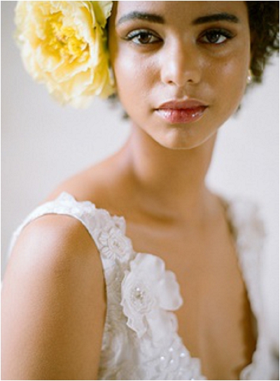 beautiful bride with yellow flower in hair