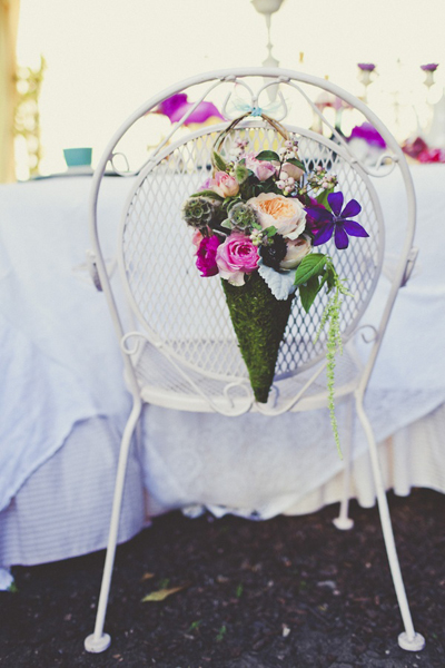 white iron chair with flowers