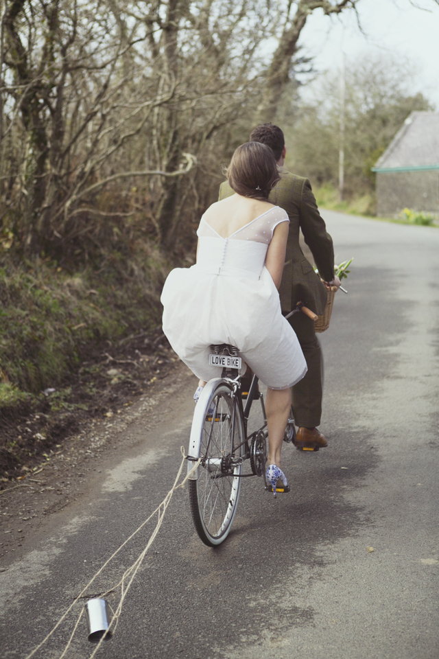 Bride and groom on 70s vintage tandem