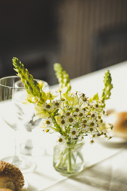 pretty wedding daisies in glass jar