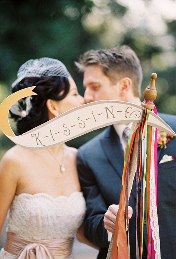 bride & groom kissing signage