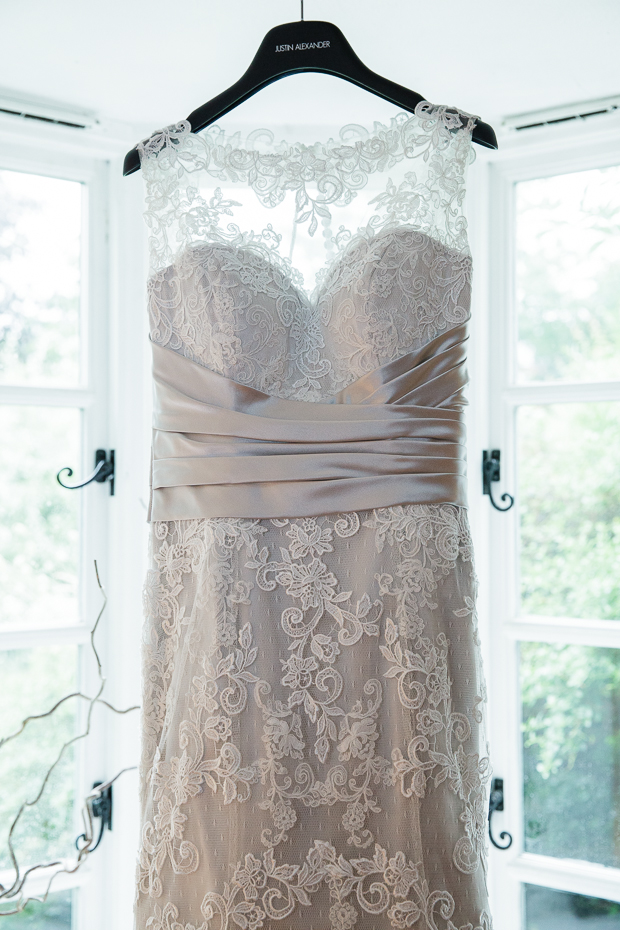 Romantic lace Justin Alexander wedding dress with hint of blush