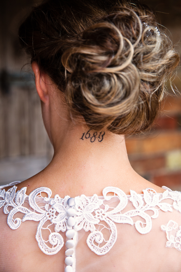 bride with wedding date tattoo on the back of neck