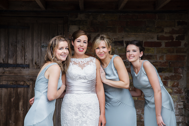 bride with bridesmaids in powder blue long dresses