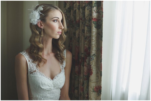 art deco inspired bride wearing art deco earring and feather fascinator