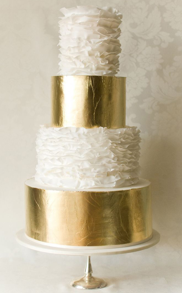 gold leaf layers and white ruffles for modern wedding cake