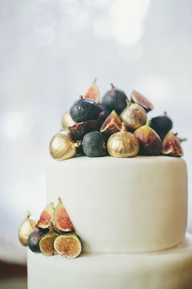 gold sprayed figs on wedding cake