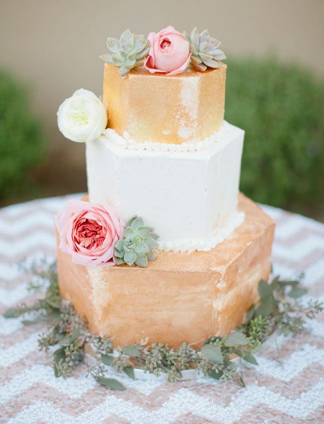 hexagonal gold wedding cake with flowers