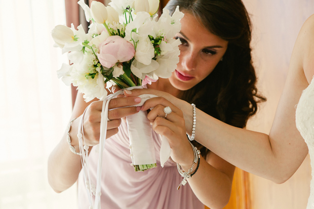 pretty tulips, freesia and peony wedding bouquet with white ribbon
