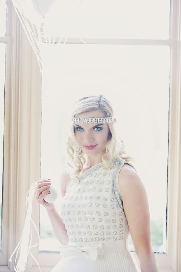 Art Deco forehead band in a geometric pattern with the finest glass crystals embroidered onto ivory illusion tulle