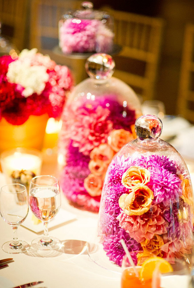 Colourful flowers under glass cloche centerpiece for weddings