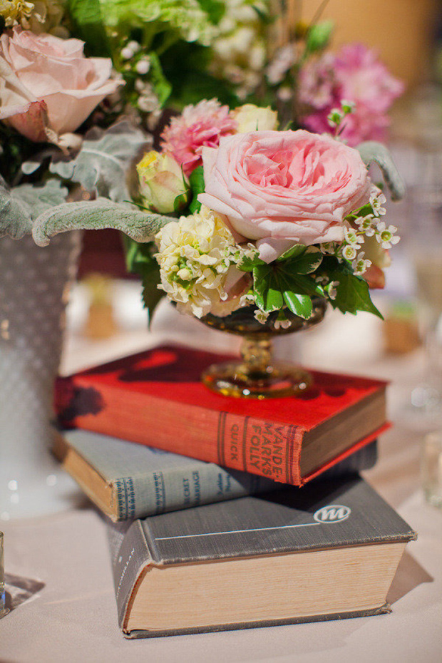 vintage books and florals as centrepieces