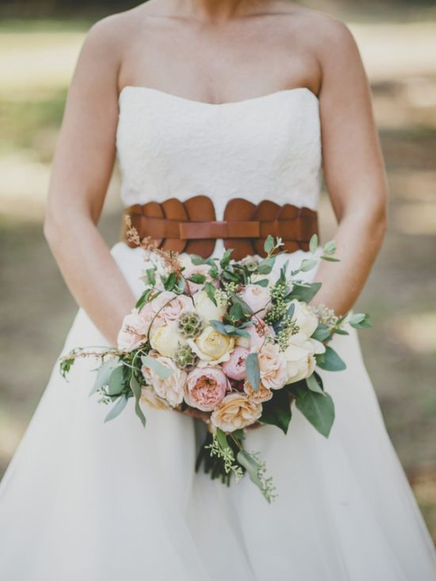 bride wearing brown leather belt and dress