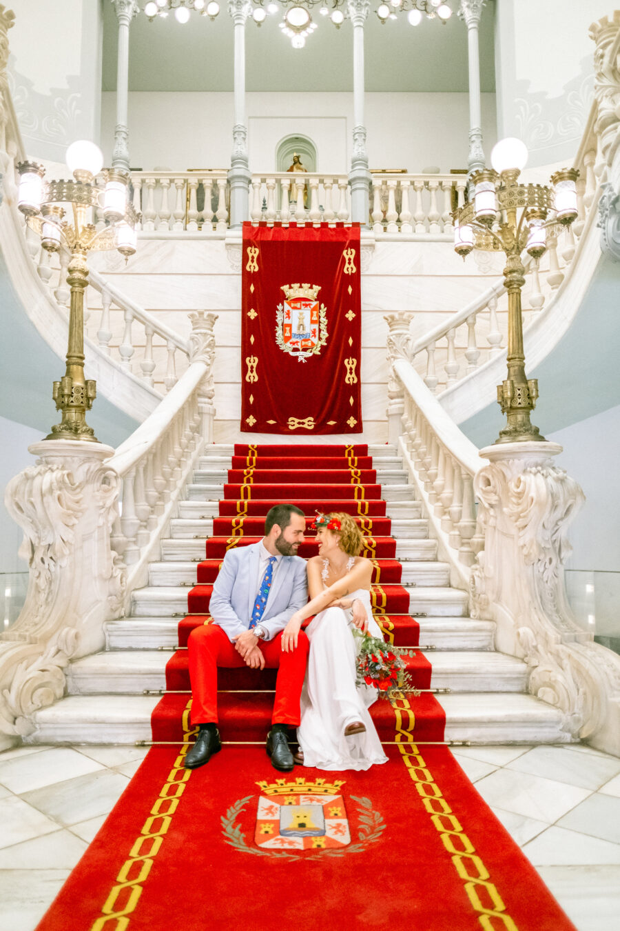 Spanish Red Wedding with Blue & Red Floral Crown: Kleio & Julio